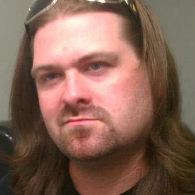 Doug Huff, long hair and sunglasses pushed up on his head