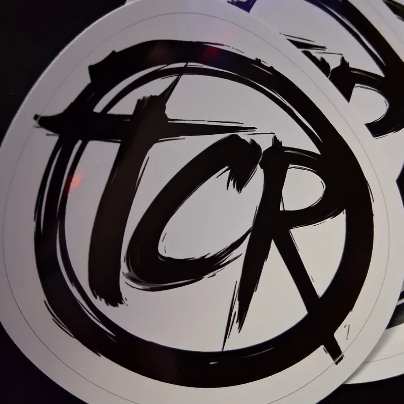 Stack of die-cut TCR seal vinyl stickers